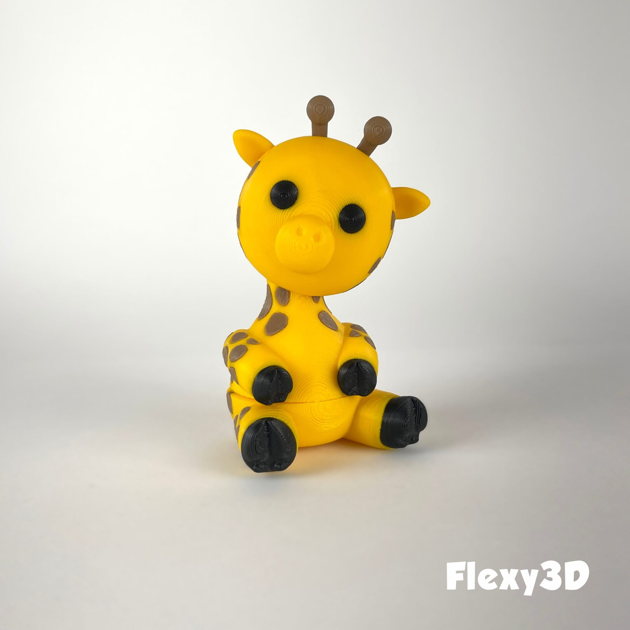 Cute yellow giraffe figurine with big eyes and small horns.