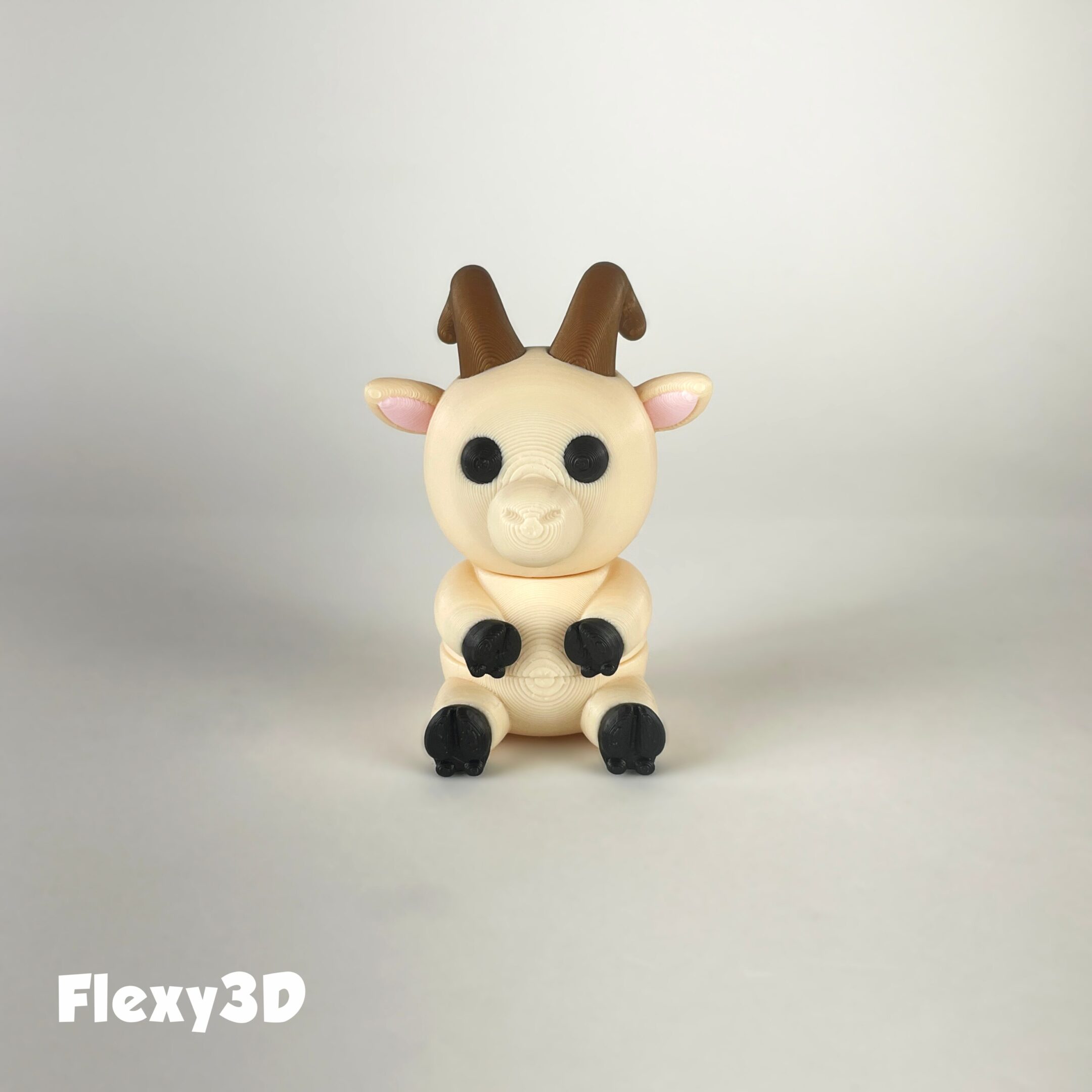 Cute 3D-printed giraffe figurine with big eyes and tiny horns.
